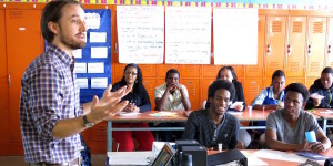 Teacher standing in front of a classroom teaching