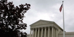 Photo of the supreme court with the flag waving