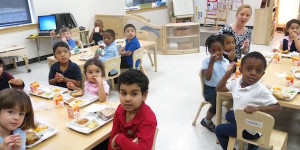 PreK students sitting in classroom looking at camera