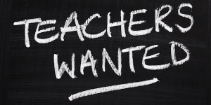 "teachers wanted" written on a chalkboard