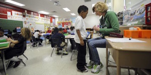 A kindergartener works with the teacher on letter sounds.. Stock photos for Chalkbeat stories. Photos made at IPS School #90, 3351 W 18th St, Indianapolis, INNov. 22, 2013. (Photo by Alan Petersime)