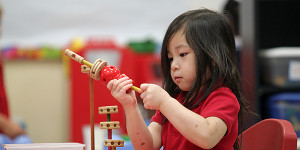 Pre-k student Jenny Dang, 4, plays with tinker toys Thursday morning at Sherman Avenue Elementary. 