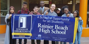 Rainer Beach students holding up school sign