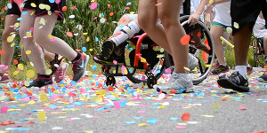 Kids racing with wheelchair inclusion