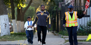 father and son walking to school