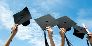 graduation hats and diploma