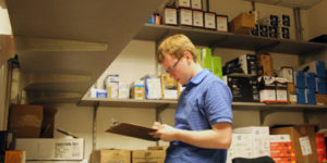 student with disability working in stock room