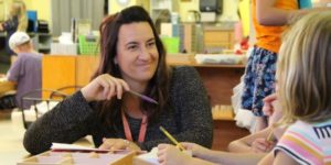 teacher smiling to student