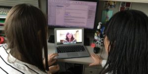 mom and daughter on Skype talking to therapist