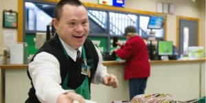 young man with disability working in customer service