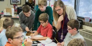 female teacher with a group of students