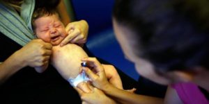 baby receiving vaccination shot