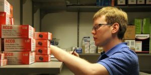 young man working in stock room