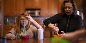 girl and mom at kitchen