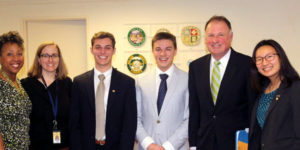 group of high school students in suits