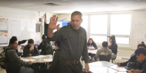 teacher gives student high-five