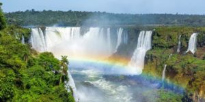 rainbow across a waterfall