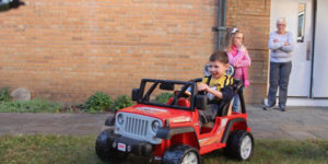 power toy car with happy boy