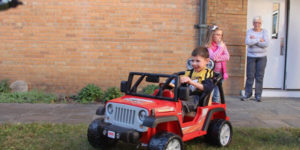 power toy car with happy boy