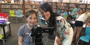 superintendent with student smiling